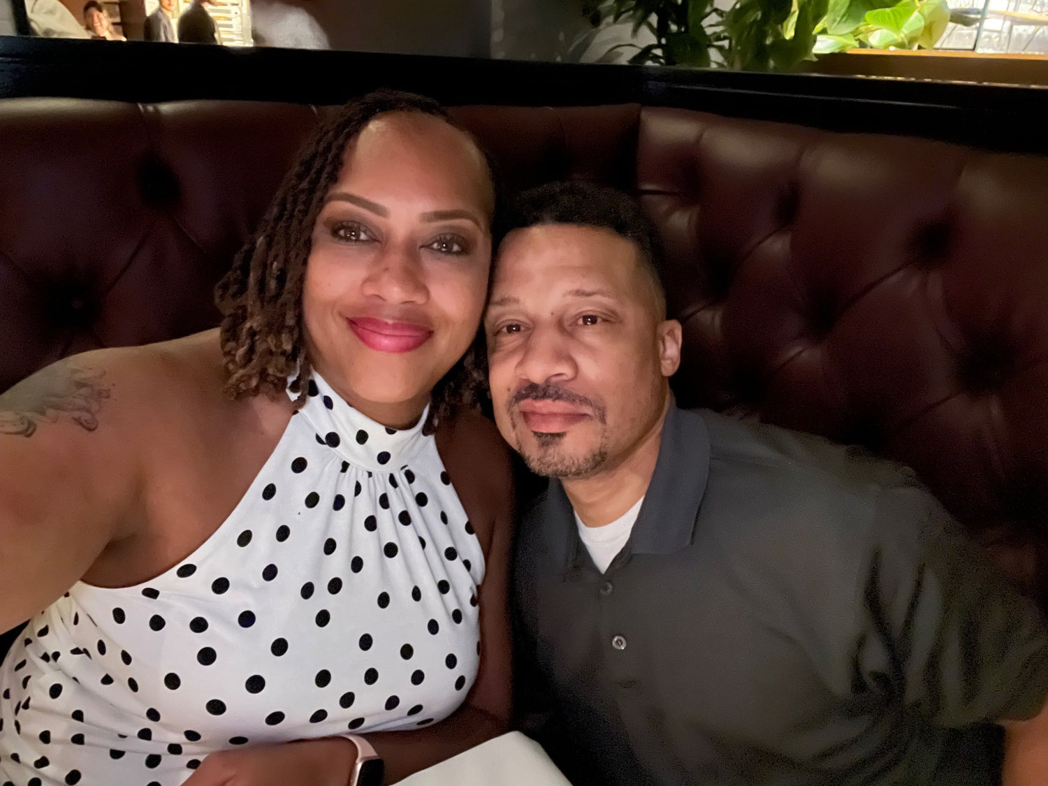 Cory and his wife celebrating their anniversary during dinner in Austin