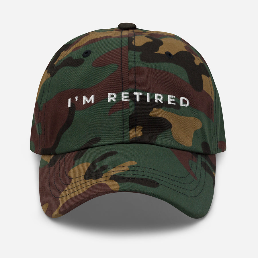 Camo embroidered I’m Retired travel dad hat from Retired Traveler (Front)