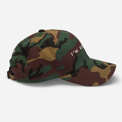Camo embroidered I’m Retired travel dad hat from Retired Traveler (Right side)