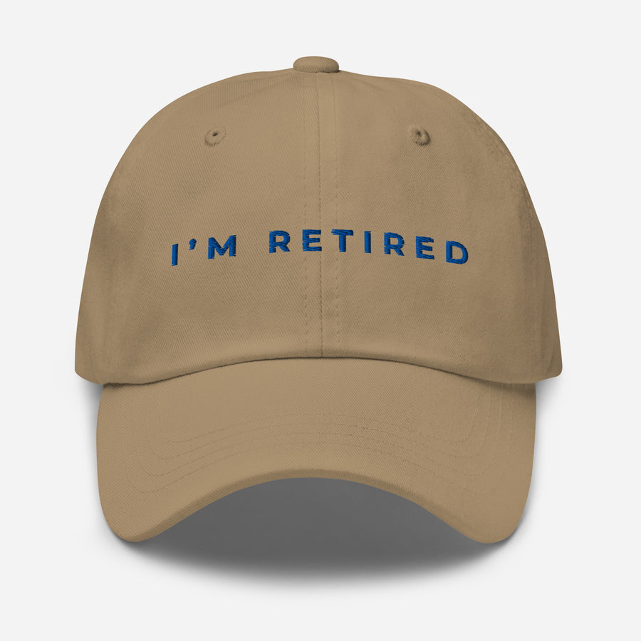 Khaki I’m Retired travel dad hat with royal blue embroidery from Retired Traveler (Front)