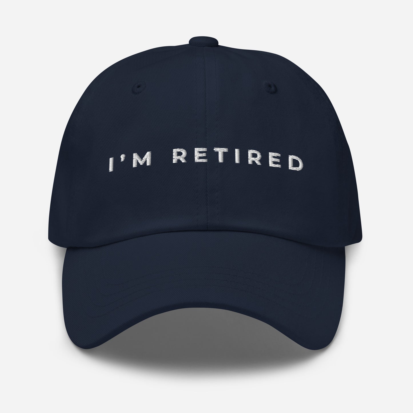 Navy embroidered I’m Retired travel dad hat from Retired Traveler (front)