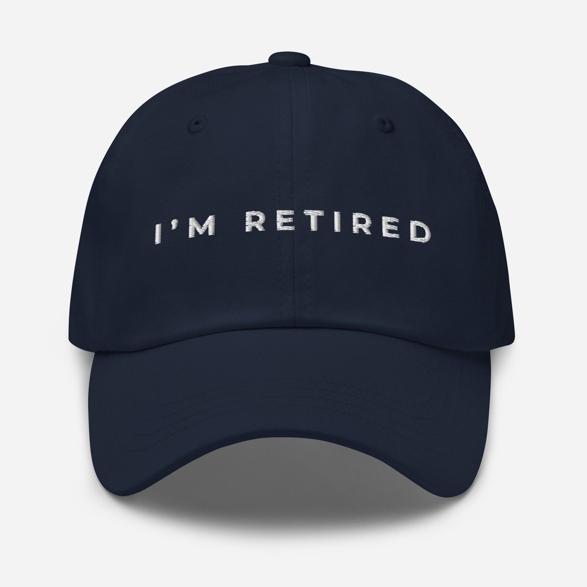 Navy embroidered I’m Retired travel dad hat from Retired Traveler (front)