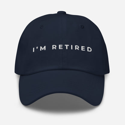 Navy embroidered I’m Retired travel dad hat from Retired Traveler (front)
