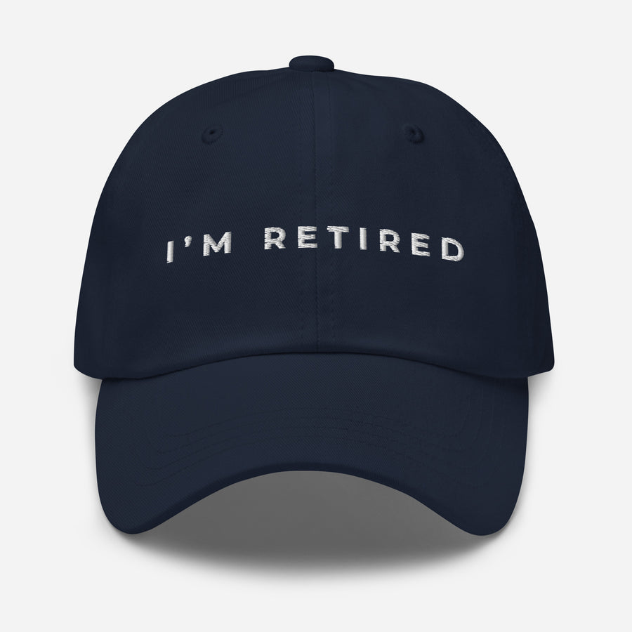 Navy embroidered I’m Retired travel dad hat from Retired Traveler (front)